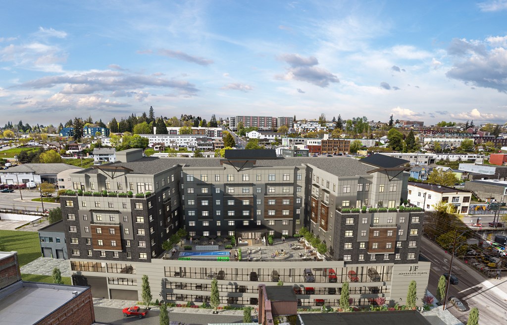 an aerial view of a city with buildings and trees
