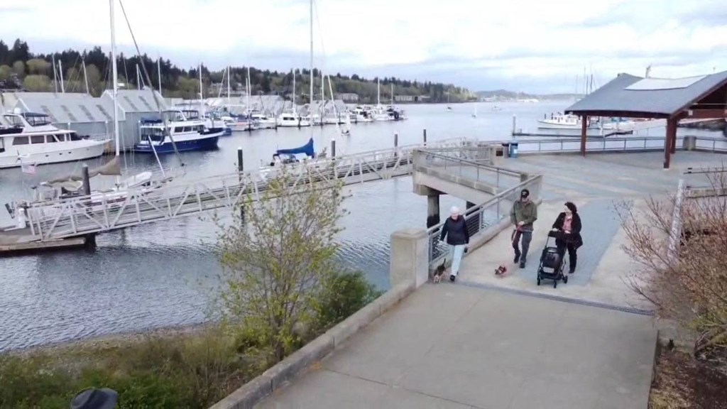 group walking by boardwalkat Harbor Heights 55+ Community, Washington