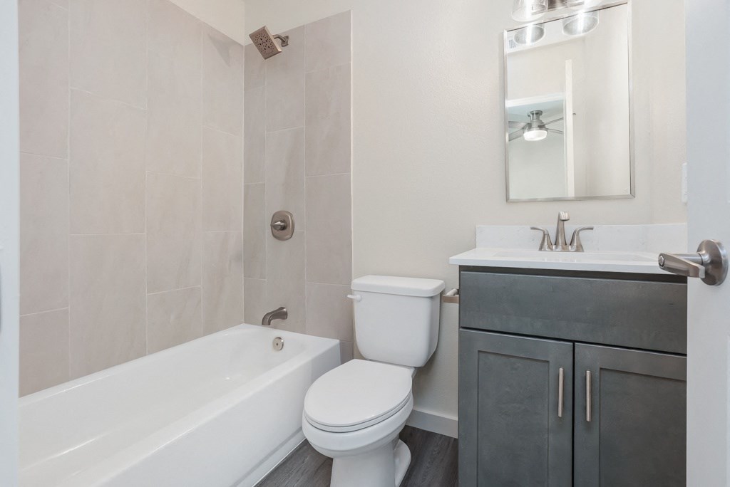 a bathroom with a sink toilet and bathtub