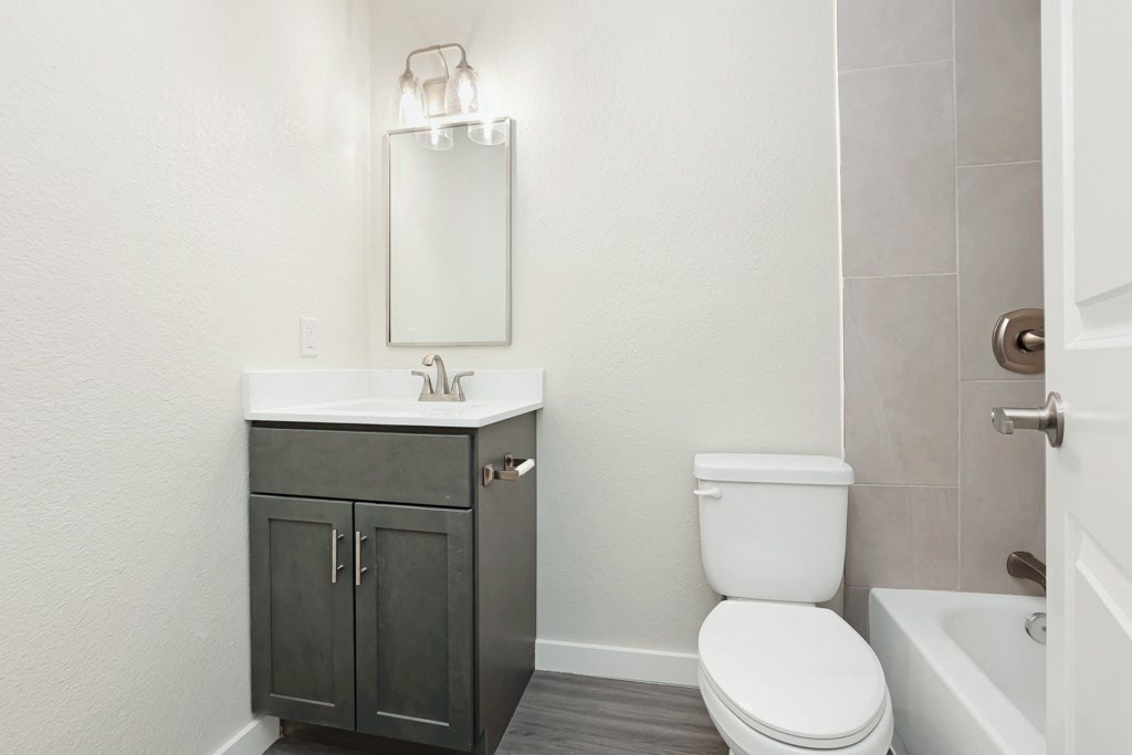 a bathroom with a sink toilet and bathtub