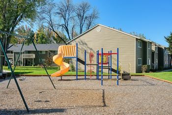 Chalet apartments play structure and swing setfor your kids to play