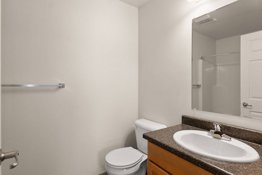 a bathroom with a sink and a toilet and a shower at Trillium Apartments, Oregon
