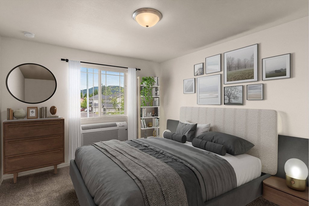 a bedroom with a bed and a window a bedroom with a bed and a window at Trillium Apartments, Springfield