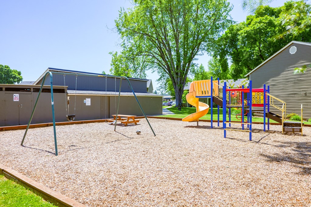 the playground at the whispering winds apartments in pearland, tx at Chalet, Springfield