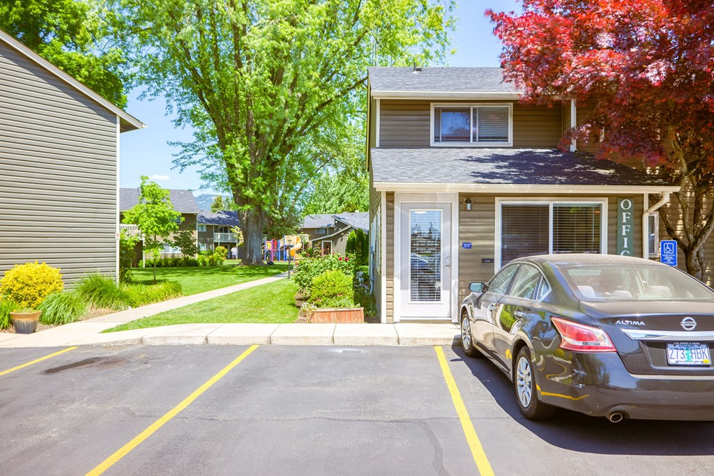 a car parked in front of a house at Chalet, Springfield, Oregon