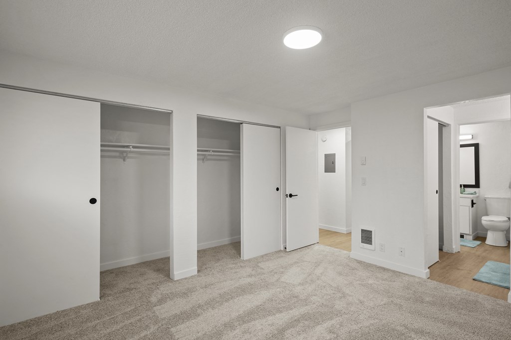 a bedroom with a carpeted floor and white walls at Chalet, Oregon