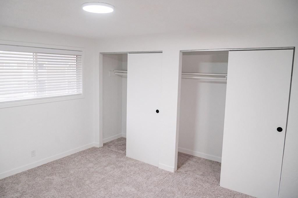 a bedroom with white walls and a window at Chalet, Springfield, OR, 97477
