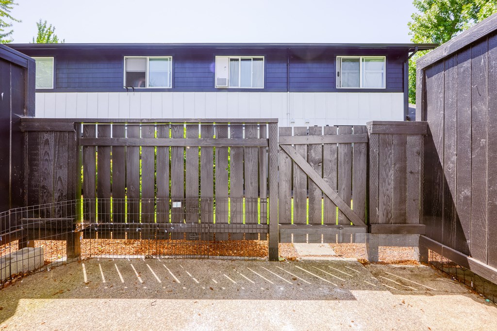 a wooden fence in front of a house