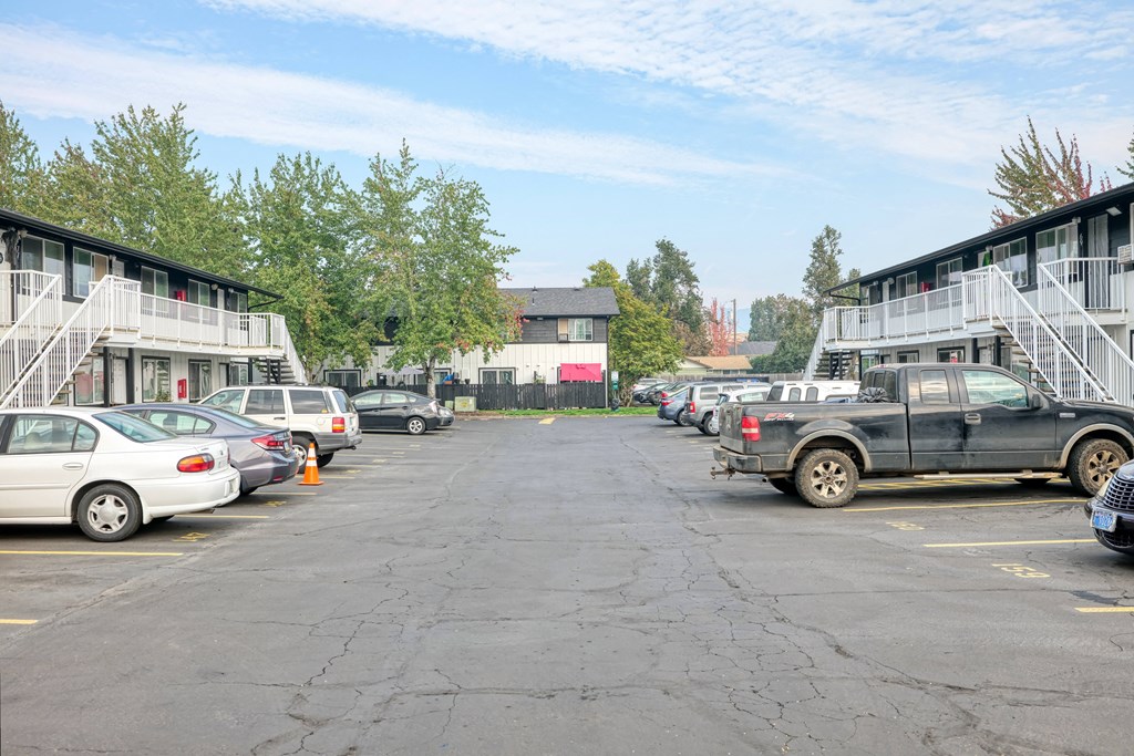 a truck parked in a parking lot in front of buildings