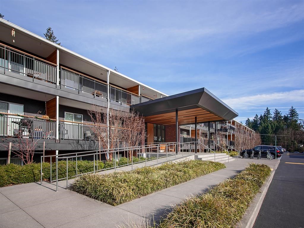 the facade of a building with a car parked outside