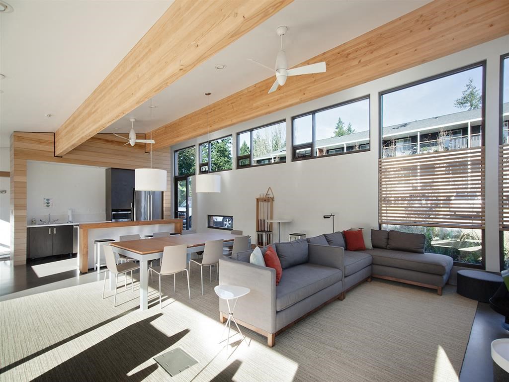 a living room and dining room with a couch and a table