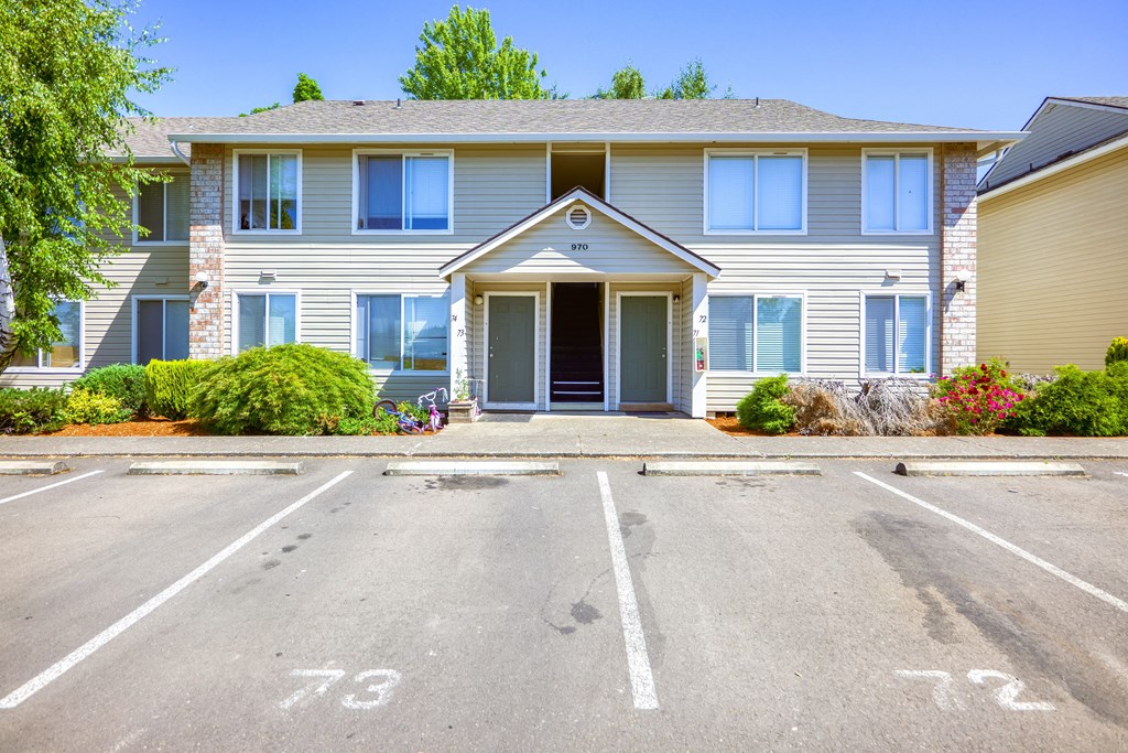 a house with a parking lot in front of it