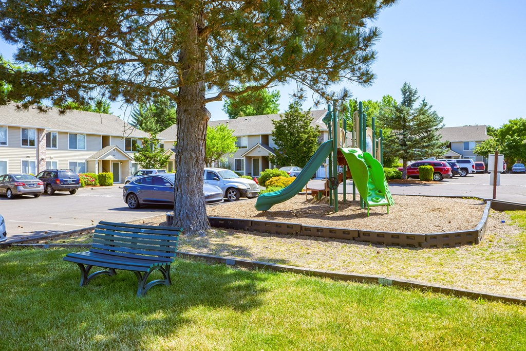 a playground at the whispering winds apartments in pearland, tx