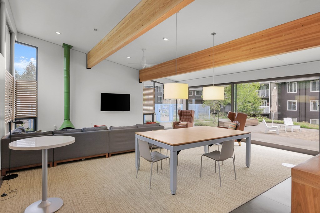 a living room with a table and chairs and a couch