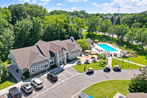 A large house with a pool in the backyard.