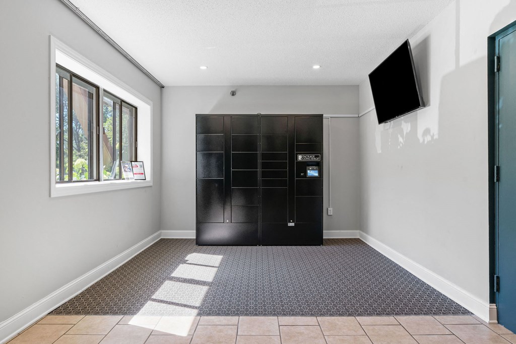 a room with a black front door and a window