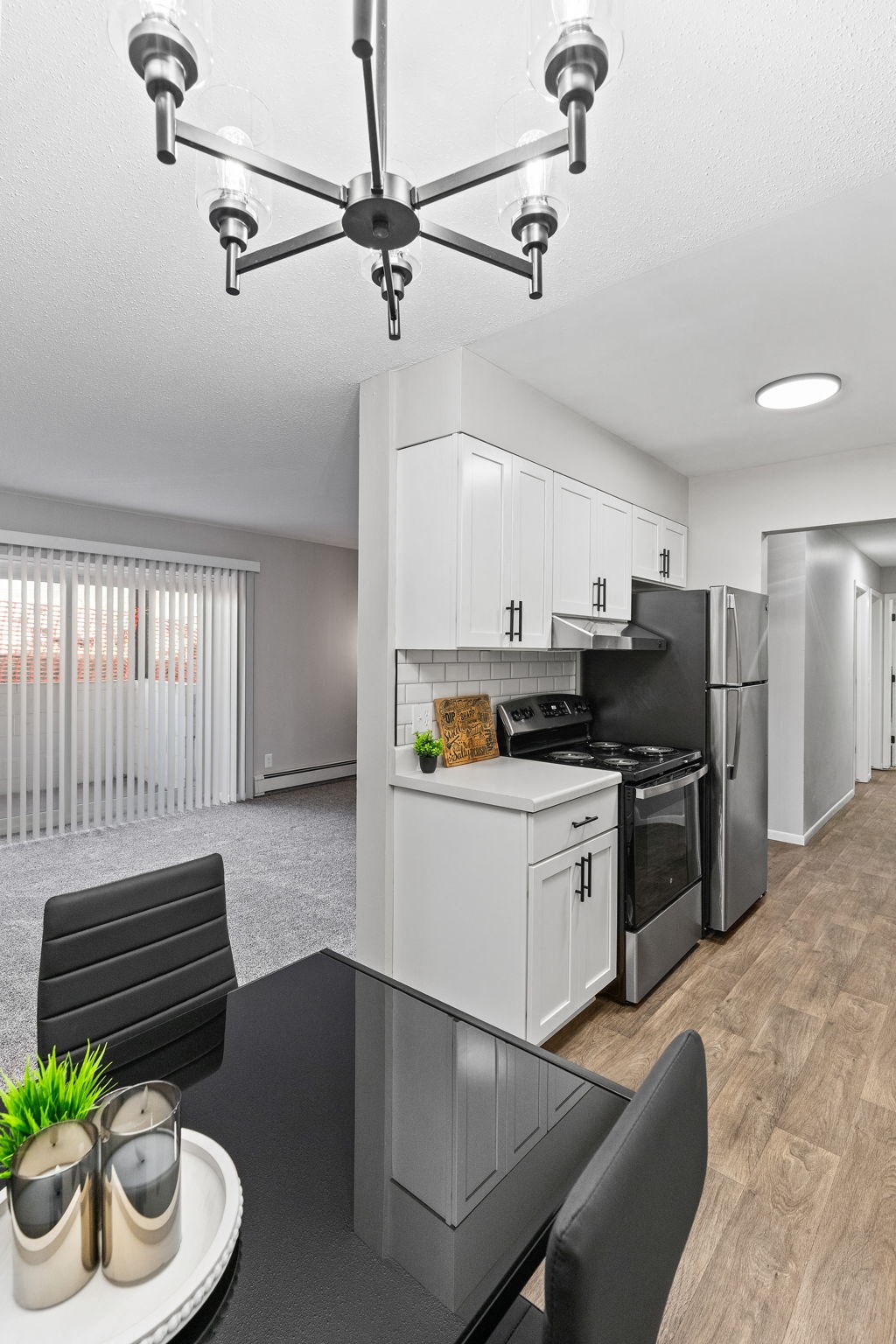 our apartments offer a kitchen and dining area with stainless steel appliances