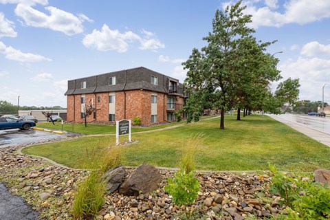 A building with a sign in front of it.