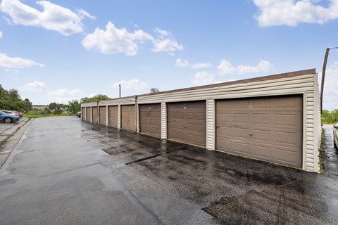 A long row of garage doors are closed.