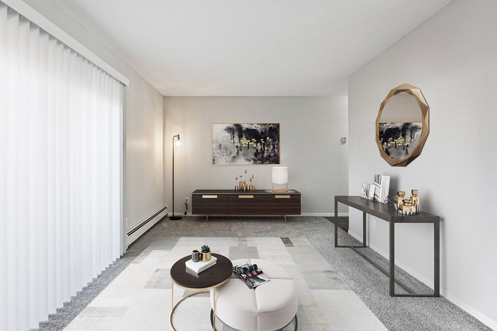 a living room with white walls and a large window