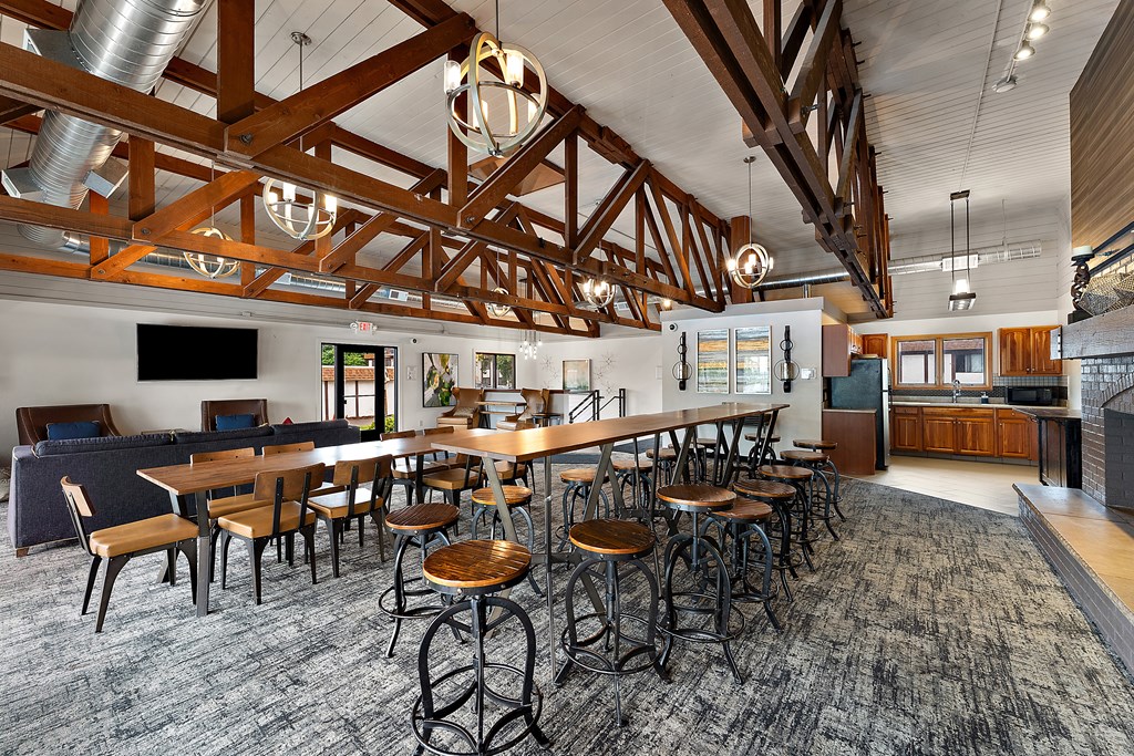 A large room with a long table and chairs.