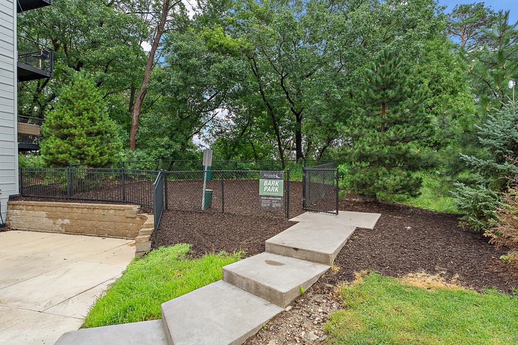 A park area with a sign and steps.