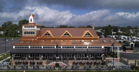 a train station with a cloudy sky in the background