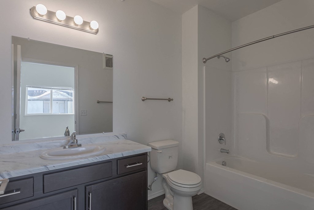 a bathroom with a sink toilet and a shower