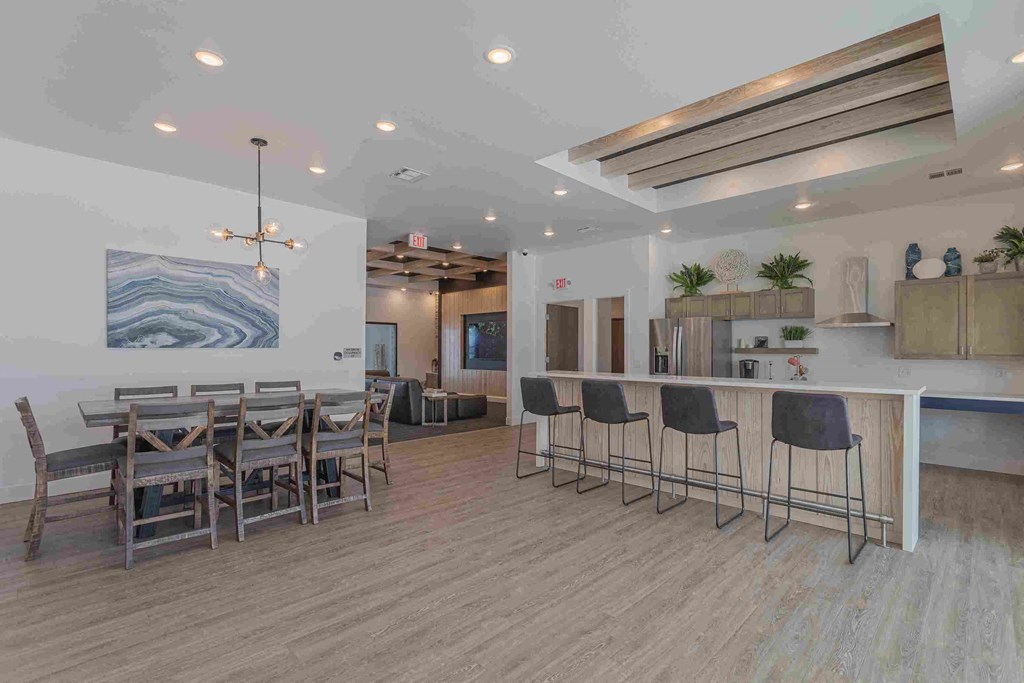 a dining room with a table and chairs and a bar