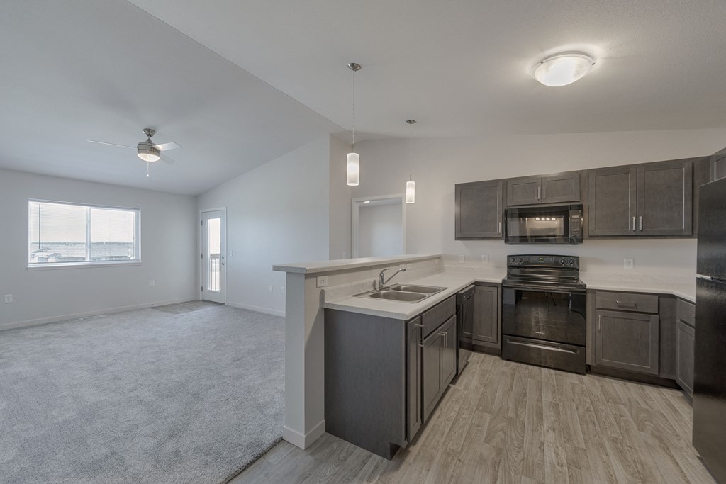 a kitchen and living room in a house