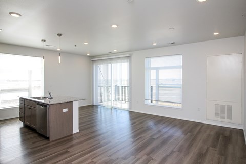 A spacious room with a desk and a window overlooking the street.