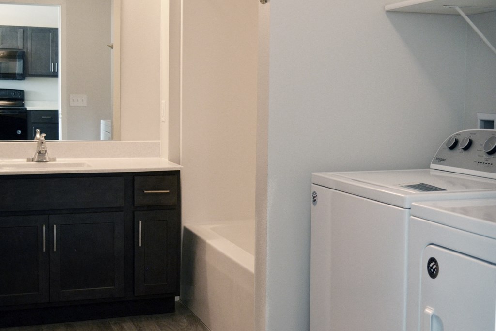 a laundry room with a washer and dryer
