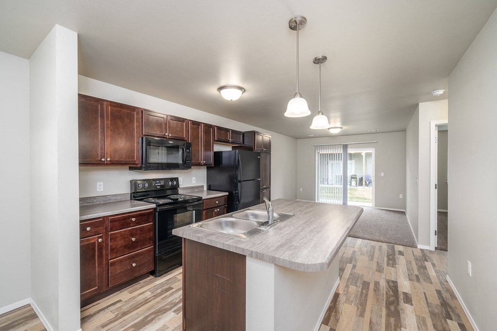 a kitchen with a large counter top and a sink