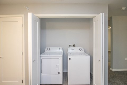 A white bathroom with a toilet and sink.