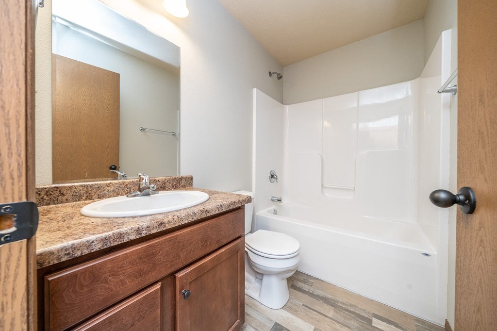 a bathroom with a sink toilet and a shower