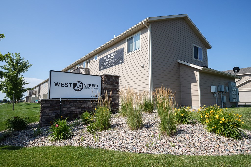 the exterior of a west 23 apartment building with a sign that reads west 23 street