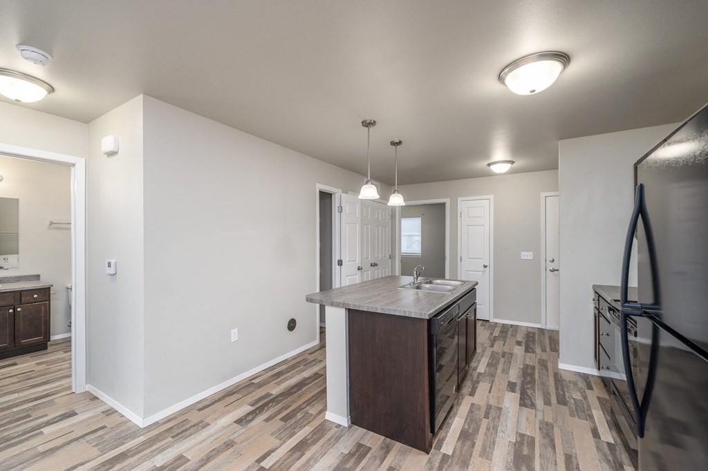 the kitchen and living room in a new home