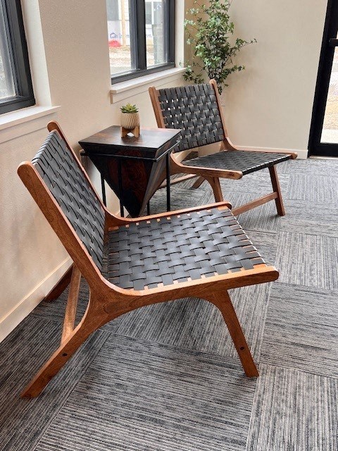 two chairs and a table in a room