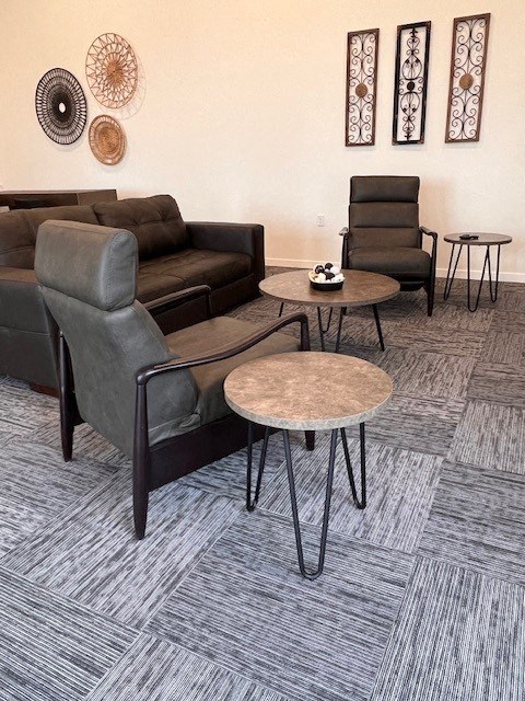 a living room with couches and tables