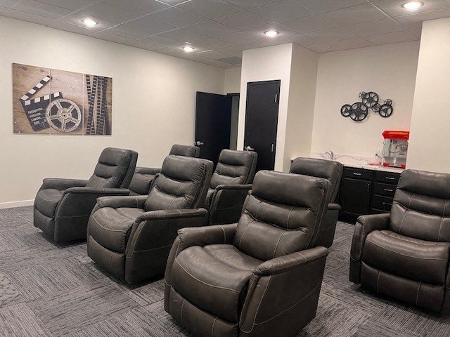 a room with a bunch of chairs in it