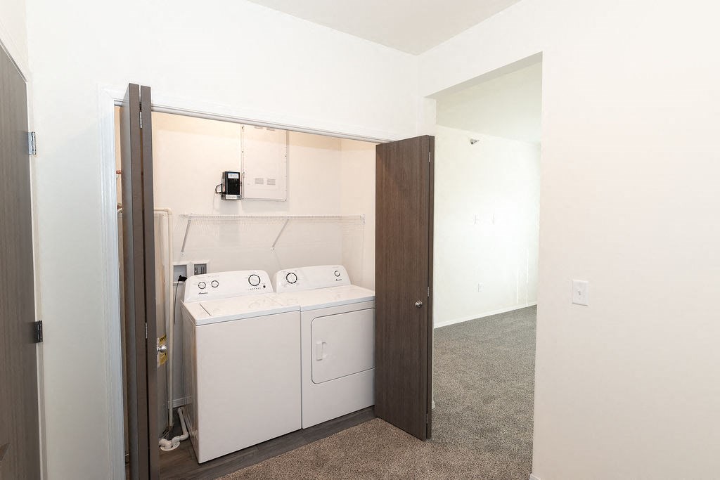 a laundry room with a washer and dryer in it