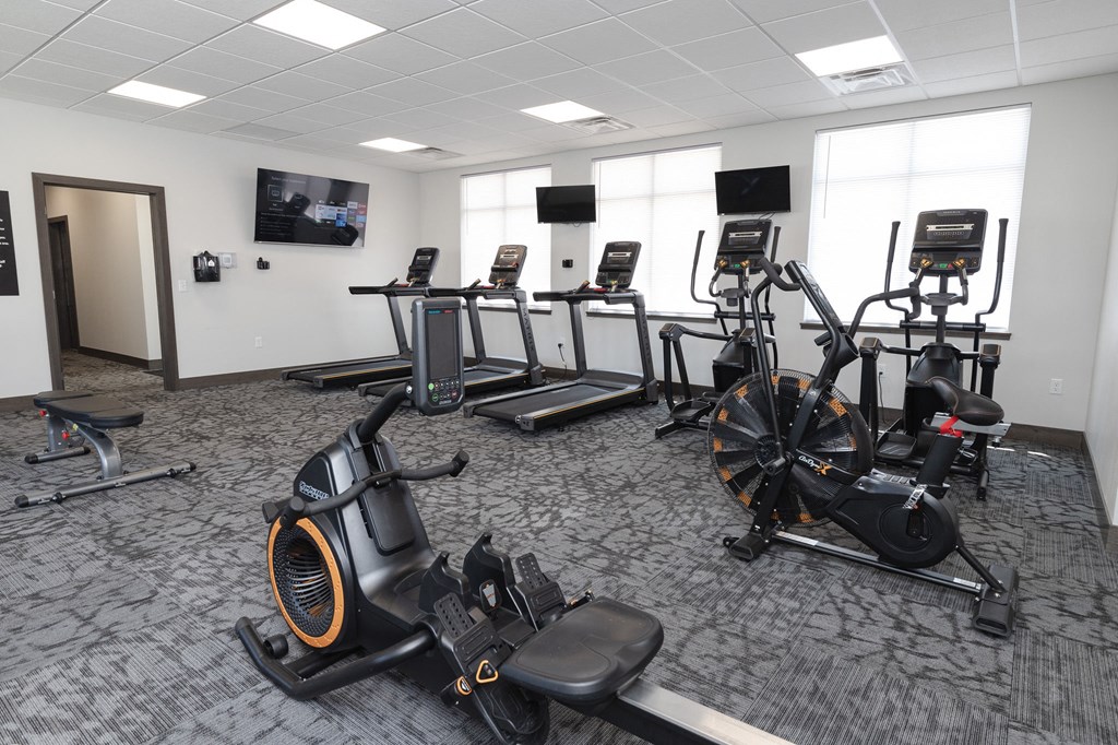 a room filled with lots of exercise equipment
