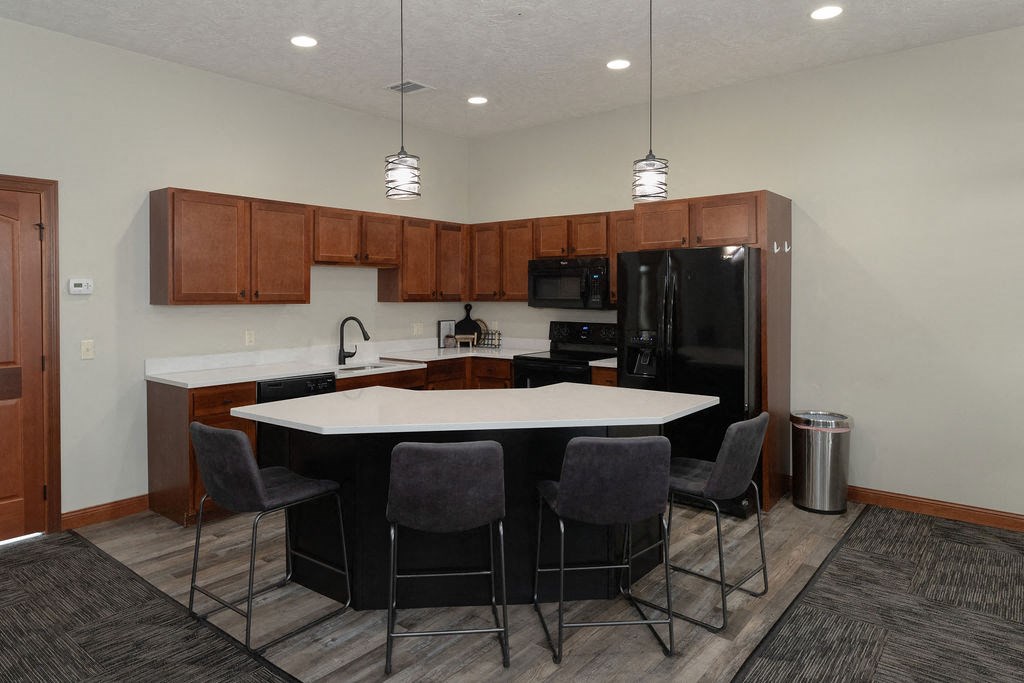 a kitchen with a table and chairs