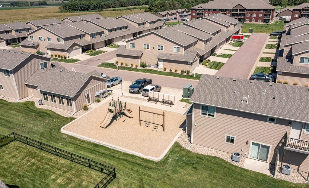 A residential area with houses and a playground.