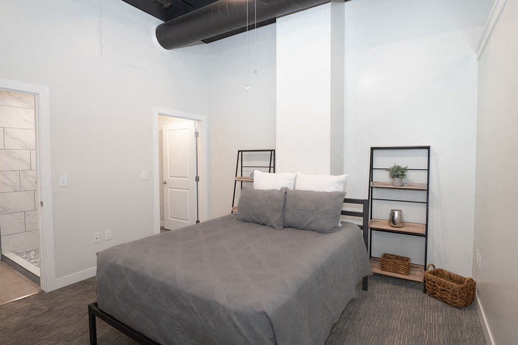 a bedroom with a bed and a closet