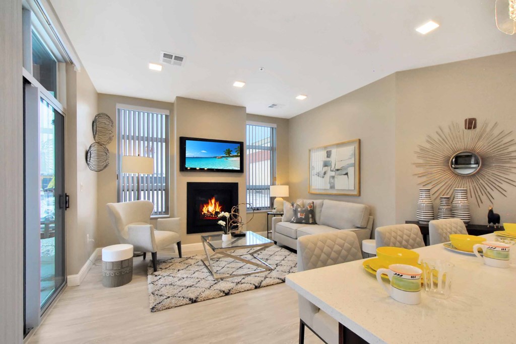 a living room with a fireplace and a table