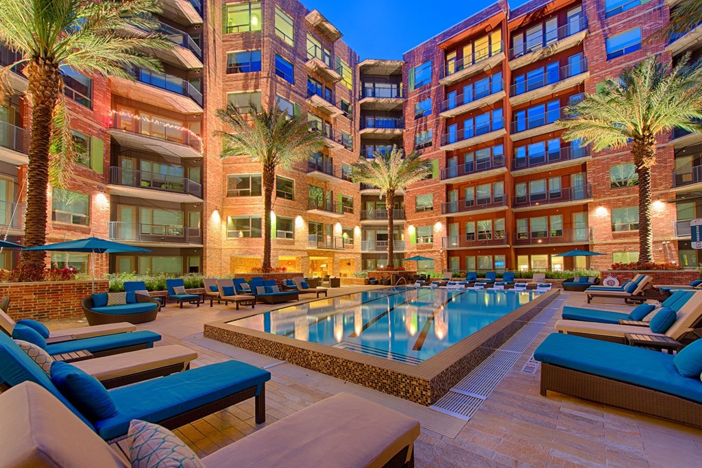 Swimming Pool With Lounge Chairs at Revl Heights Apartments, The Barvin Group, Texas, 77009