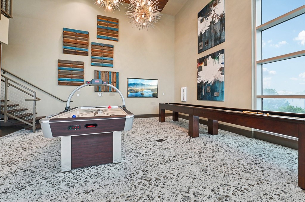 A shiny pool table with a white cloth on it.