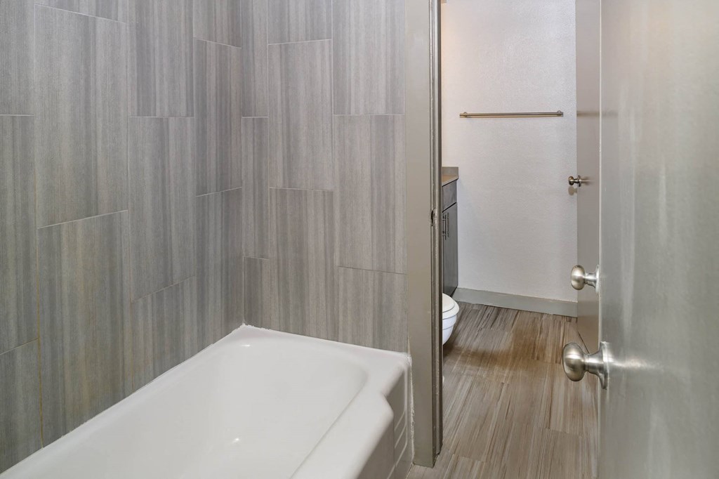 Oval Tub with Subway Tile at Memorial Towers Apartments, The Barvin Group, Houston, TX, 77007