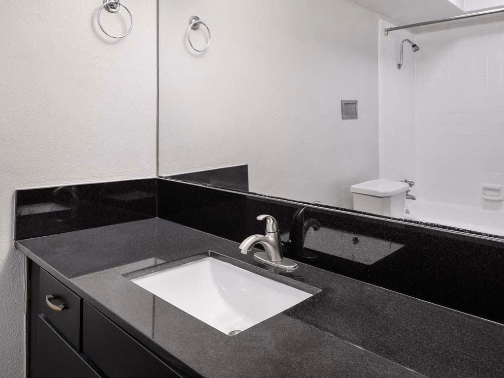 Renovated Bathrooms With Quartz Counters at Memorial Towers Apartments, The Barvin Group, Houston, TX